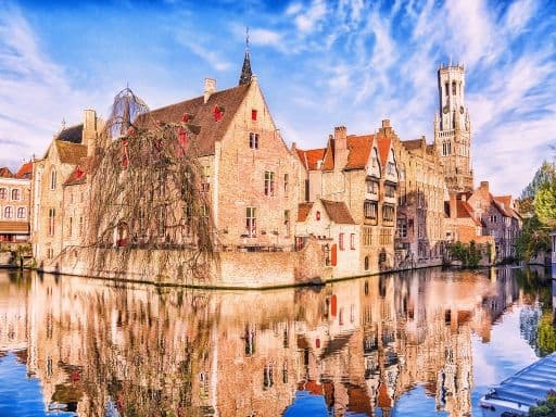 tower Belfort and houses in medieval fairytale town Bruges