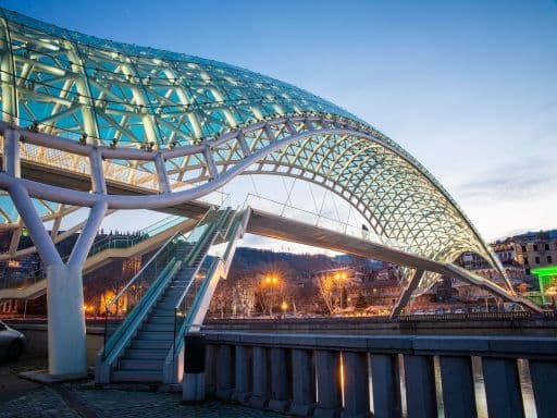 The Bridge of Peace over the Kura River in Tbilisi during twilight